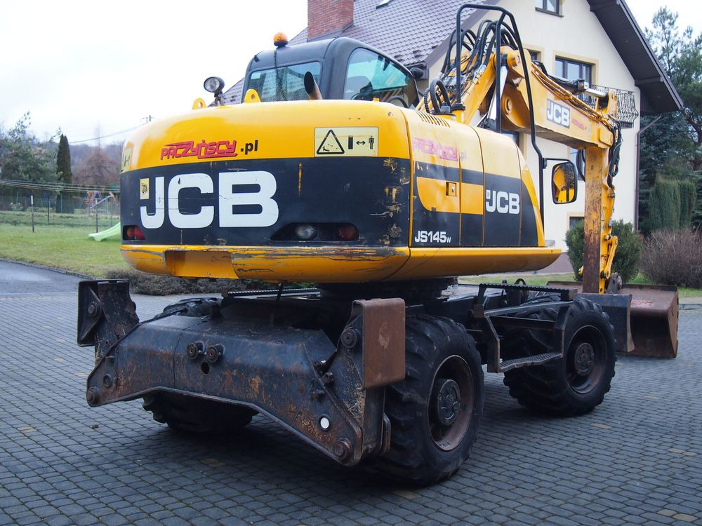 휠 굴삭기 Koparka kołowa JCB JS145W 2011 Koparka JCB : 사진 9