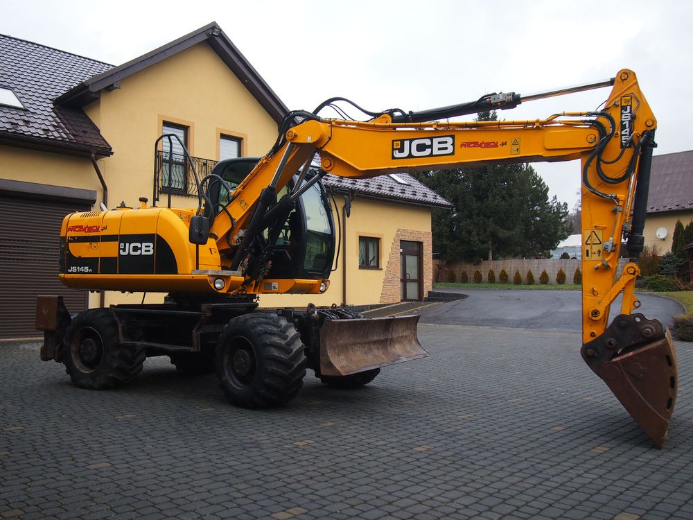 휠 굴삭기 Koparka kołowa JCB JS145W 2011 Koparka JCB : 사진 6